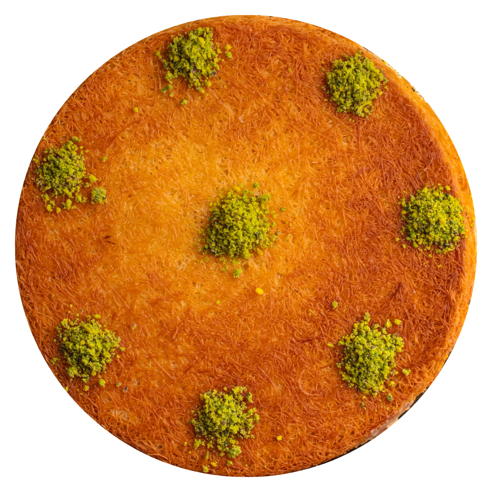 Lebanese kunafeh dessert topped with pistachios